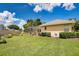 Large backyard with a pool and garden at 1556 Auburn Oaks Ct, Auburndale, FL 33823
