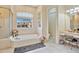 Spa-like bathroom with soaking tub, separate shower, and a vanity with ample storage at 1556 Auburn Oaks Ct, Auburndale, FL 33823