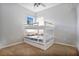 bedroom with a bunk bed and plush carpet at 1556 Auburn Oaks Ct, Auburndale, FL 33823