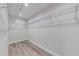 Large walk-in closet with wire shelving at 157 S Lakeview Dr, Lake Helen, FL 32744