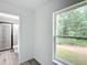 Bedroom with window and en-suite bathroom access at 22474 Sw Rainbow Lakes Blvd, Dunnellon, FL 34431