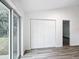 Bright bedroom with wood-look floors and large closet at 22474 Sw Rainbow Lakes Blvd, Dunnellon, FL 34431
