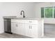 Kitchen island with granite countertop and white shaker cabinets at 245 Oak Lane Way, Ocala, FL 34472