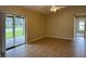 Living area with tile floor and sliding glass doors to patio at 2633 Daffadil Ter, Sanford, FL 32771