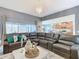 Living room with sectional sofa and view of kitchen at 301 Blue Lake Cir, Kissimmee, FL 34758