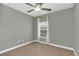 Bright bedroom featuring a window with curtains and ceiling fan at 329 Memphis Cir, Lake Mary, FL 32746