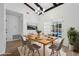 Virtually staged dining room with hardwood floors and modern chandelier at 3756 Peaceful Pl, Orlando, FL 32810