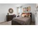 Cozy bedroom with a double bed, dresser, and wall art at 4141 Giorgio Dr, Winter Haven, FL 33884