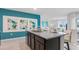 Kitchen island with granite countertops and dark brown cabinets at 4141 Giorgio Dr, Winter Haven, FL 33884