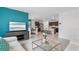 Open living room showcasing a comfortable sofa and a view into the kitchen at 4141 Giorgio Dr, Winter Haven, FL 33884