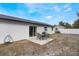 Newly painted home with a backyard patio and large grassy area at 4856 Victory Dr, Orlando, FL 32808