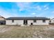 Newly painted home with a backyard patio and large grassy area at 4856 Victory Dr, Orlando, FL 32808