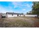 Newly painted home with a backyard patio and large grassy area at 4856 Victory Dr, Orlando, FL 32808