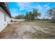 Large backyard with grassy area and patio furniture at 4856 Victory Dr, Orlando, FL 32808