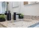 Modern bathroom with granite countertop, black matte faucet, and stylish decor at 4856 Victory Dr, Orlando, FL 32808