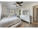 Bright bedroom with a queen-size bed, dresser, and ceiling fan at 4856 Victory Dr, Orlando, FL 32808