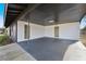 Covered carport with attached storage and concrete floor at 4856 Victory Dr, Orlando, FL 32808