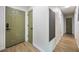 Light and bright hallway with new flooring and doors at 4856 Victory Dr, Orlando, FL 32808