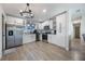 Modern kitchen with stainless steel appliances and white shaker cabinets at 4856 Victory Dr, Orlando, FL 32808