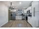Modern kitchen with stainless steel appliances and white shaker cabinets at 4856 Victory Dr, Orlando, FL 32808