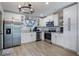 Modern kitchen with stainless steel appliances and white shaker cabinets at 4856 Victory Dr, Orlando, FL 32808