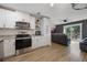 Modern kitchen with stainless steel appliances and white shaker cabinets at 4856 Victory Dr, Orlando, FL 32808