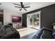 Living room with sliding glass doors to patio, gray sofas and wood-look floors at 4856 Victory Dr, Orlando, FL 32808