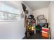 Storage area with shelving, gardening tools, and storage bins at 4856 Victory Dr, Orlando, FL 32808