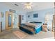 Bright bedroom featuring a king-size bed and access to a bathroom at 6399 Lolly Bay Ne Loop, Winter Haven, FL 33881