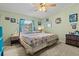 Cozy bedroom with a queen-size bed and ample natural light at 6399 Lolly Bay Ne Loop, Winter Haven, FL 33881