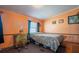 Small bedroom with a full-size bed and workspace at 6399 Lolly Bay Ne Loop, Winter Haven, FL 33881
