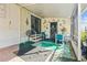 Covered patio with seating area, perfect for relaxing at 6399 Lolly Bay Ne Loop, Winter Haven, FL 33881