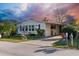 Mobile home exterior features a landscaped yard and a driveway at 6399 Lolly Bay Ne Loop, Winter Haven, FL 33881