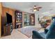 Living area with access to a screened porch and built-in bookcase at 6399 Lolly Bay Ne Loop, Winter Haven, FL 33881