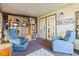 Bright sunroom with comfortable seating and ample storage at 6399 Lolly Bay Ne Loop, Winter Haven, FL 33881