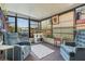Relaxing sunroom with comfy seating and large windows at 6399 Lolly Bay Ne Loop, Winter Haven, FL 33881