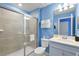 Clean bathroom with shower/tub combo and vanity at 7160 Oakmoss Loop Loop, Davenport, FL 33837