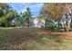 Exterior view of home with manicured lawn and tropical plants at 897 Eagle Claw Ct, Lake Mary, FL 32746