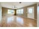 Living room with laminate floors and exterior door at 1000 W Lakeshore Dr, Clermont, FL 34711