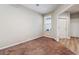 Bright bedroom with carpeted floor and window with blinds at 1203 Bella Rose Ct, Davenport, FL 33896