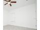 Well-lit bedroom with ceiling fan and tile flooring at 15398 Sw 22Nd Court Rd, Ocala, FL 34473