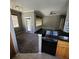 Kitchen with granite countertops and wooden cabinets at 2598 Robert Trent Jones Dr # 1010, Orlando, FL 32835