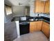 Kitchen boasts granite countertops and modern appliances at 2598 Robert Trent Jones Dr # 1010, Orlando, FL 32835