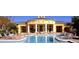 Community pool with clubhouse and surrounding lounge chairs at 2598 Robert Trent Jones Dr # 1010, Orlando, FL 32835
