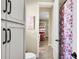 Bathroom features a toilet, shower, and a view into a bedroom at 3875 Grassland Loop, Lake Mary, FL 32746