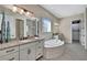 Luxurious Primary bathroom with soaking tub and walk-in shower at 3875 Grassland Loop, Lake Mary, FL 32746