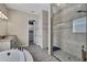 Primary bathroom with walk-in shower and double vanity at 3875 Grassland Loop, Lake Mary, FL 32746