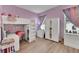 Girly bedroom with a bunk bed, built in shelving, and a desk at 3875 Grassland Loop, Lake Mary, FL 32746