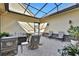 Relaxing covered patio with seating area and fire pit at 3875 Grassland Loop, Lake Mary, FL 32746