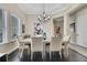 Bright dining room with modern chandelier and hardwood floors at 3875 Grassland Loop, Lake Mary, FL 32746